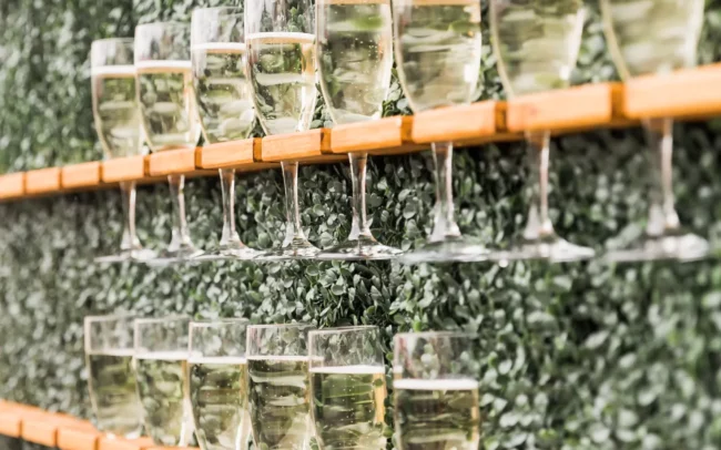 Wall of wine glasses are the perfect wedding decoration, offered at CrossKeys Vineyards